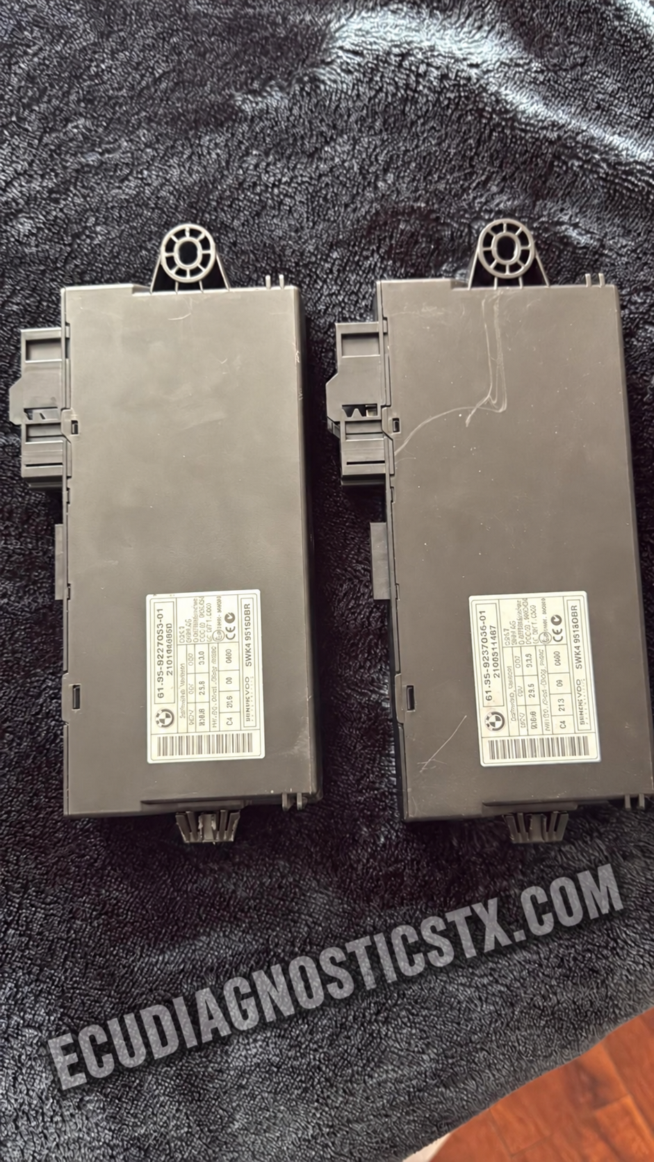 Original and replacement BMW E90 CAS modules after mobile no-crank diagnosis in Houston
